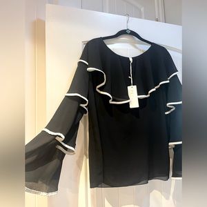 Beautiful black top I brought back from Italy no size but I would say a medium